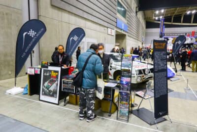 富士モータースポーツミュージアムのブースでは収蔵車両のフォトカードなどオリジナルグッズも販売していた