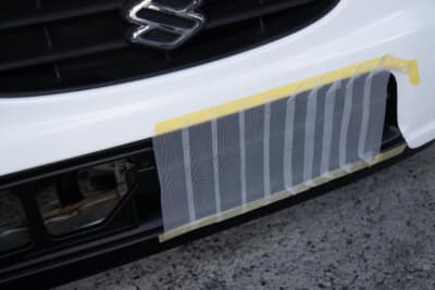 スズキ HA23S型 アルト:バンパーの開口部をテープで塞ぎオーバークール対策。水温の管理も勝つためには必須だ