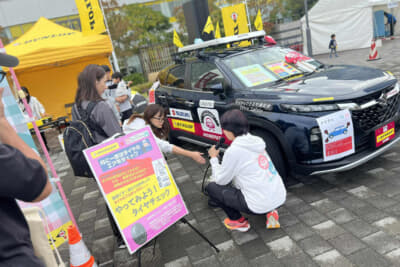 スズキ「フロンクス」の新しいOKISHU号でのクイズ、ダンロップ・シンクロウェザータイヤの空気圧チェック、京都トヨタの新開さんや立命館大学、アイシン、GRガレージ京都伏見からの豪華プレゼント、そしてダンロップさんのサポートもいただきましたの